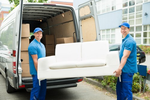 Moving company staff reviewing a customer complaint document