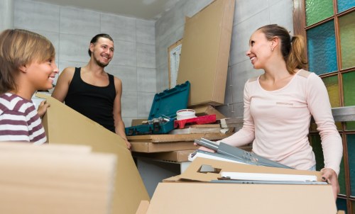 Movers handling residential relocation in a Paddington flat with stairs