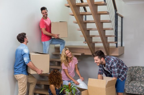 Piano removals team preparing a piano move in a Paddington home