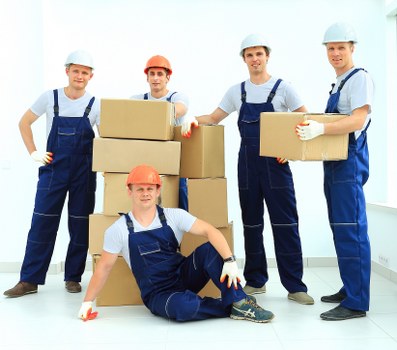 Packed boxes and furniture ready for transport in a Paddington home