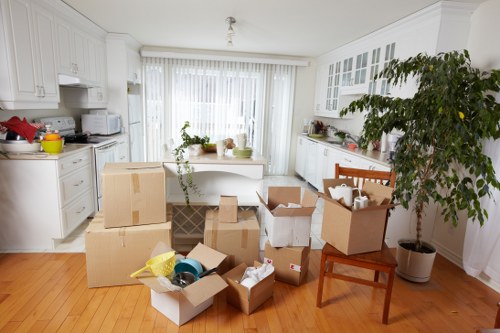 House moving team loading furniture on a narrow inner-city street