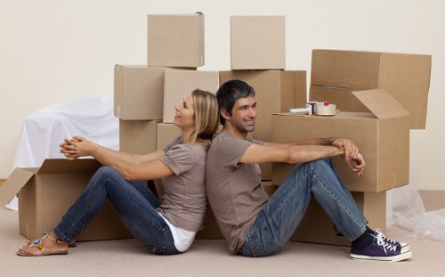 Movers assessing access and handling fragile belongings during a Paddington relocation