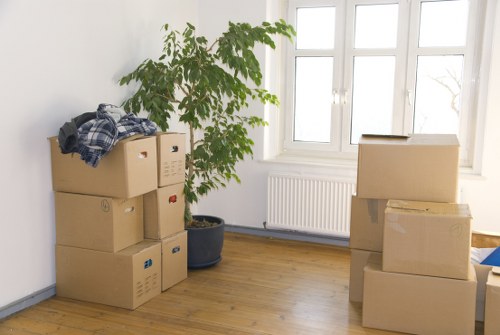 Packing and loading items into a moving van near Paddington