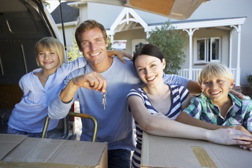 Removal team handling household items with care
