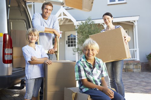 Student moving items into a new Paddington flat with boxes and furniture