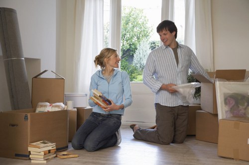 Professional movers organizing boxes in a Paddington apartment building
