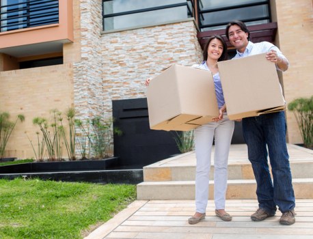 Professional movers working in a busy Paddington street